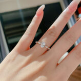 Sophisticated Oval-Cut Cubic Zirconia Sterling Silver Ring display on model's finger