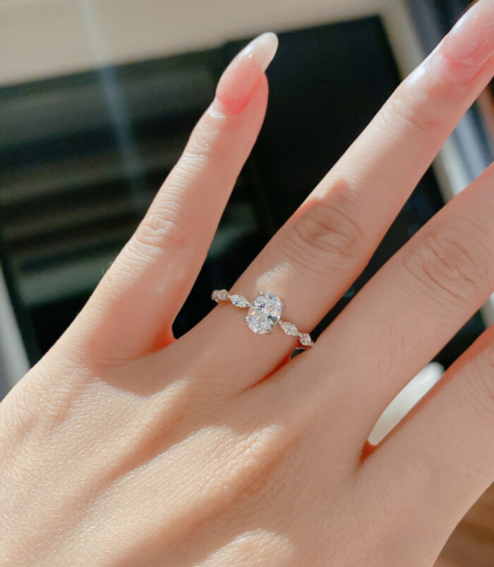 Sophisticated Oval-Cut Cubic Zirconia Sterling Silver Ring display on model's finger