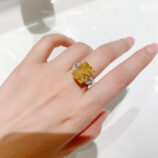 Luxury Yellow Emerald-Cut Three-Stone Sterling Silver Ring on model's finger