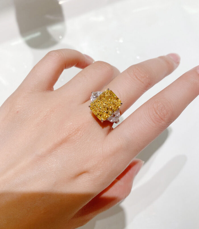 Luxury Yellow Emerald-Cut Three-Stone Sterling Silver Ring on model's finger