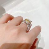 back view close-up of Luxury Yellow Emerald-Cut Three-Stone Sterling Silver Ring on model's finger
