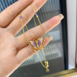 hand held details of Sterling silver purple enamel butterfly necklace