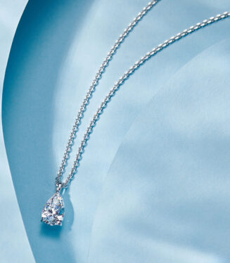 side view close-up of Sterling Silver Solitaire Pear-Shaped Zirconia Pendant Necklace