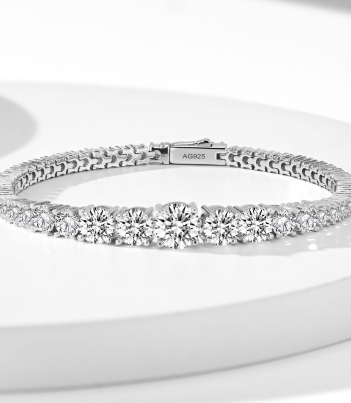 Sparkling 925 silver bracelet with a tennis-style design, featuring a full row of clear, round-cut stones which is gradient size