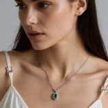 Sterling Silver Pear-Cut Green Cubic Zirconia Halo Pendant Necklace worn on model'd necklace
