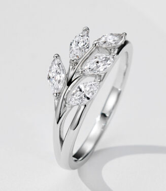 Nature-inspired sterling silver bypass ring featuring a cluster of five marquise-cut cubic zirconia stones arranged in a leaf-like pattern on a polished split band, creating a unique and organic look perfect for adding a touch of natural beauty to any outfit.