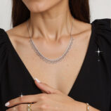 rhodium plated Sterling silver lace-trimmed necklace worn around model's neck