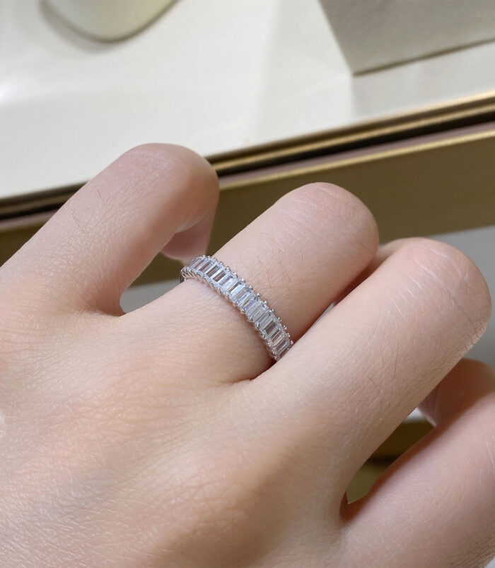 Rhodium plated Baguette-Cut Zirconia Sterling Silver Band Ring worn on a model's finger