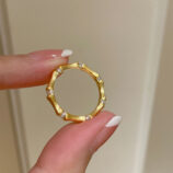 hand held close-up of Nature-Inspired Bamboo Design Textured Sterling Silver Ring