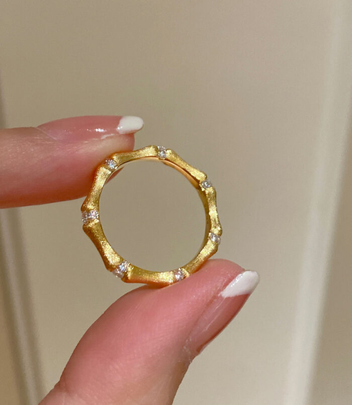 hand held close-up of Nature-Inspired Bamboo Design Textured Sterling Silver Ring