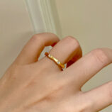 yellow gold color Nature-Inspired Bamboo Design Textured Sterling Silver Rings worn on model's finger