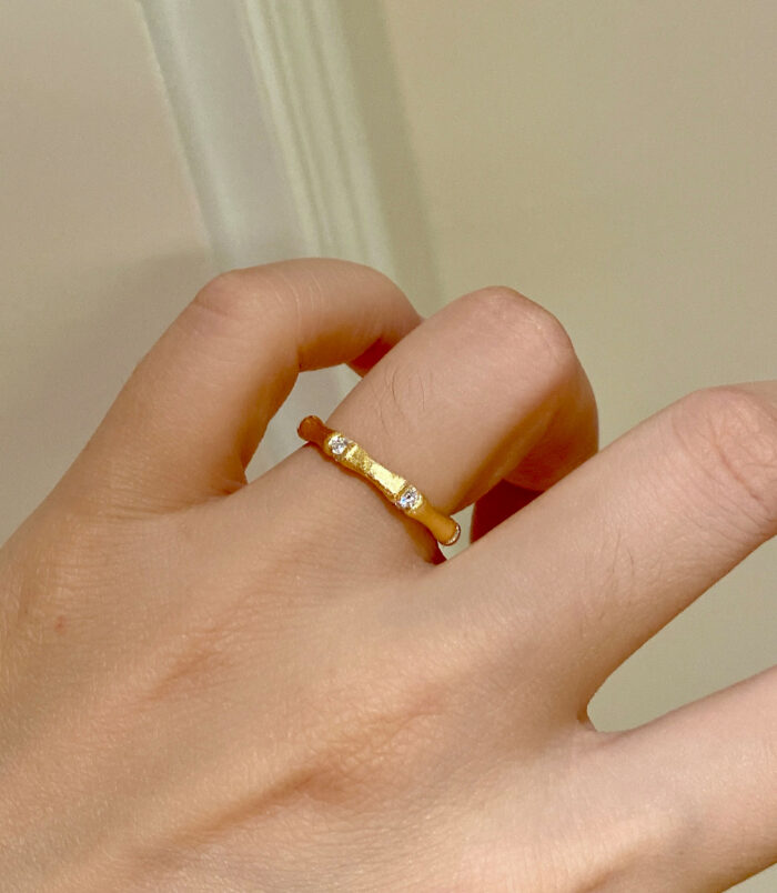 yellow gold color Nature-Inspired Bamboo Design Textured Sterling Silver Rings worn on model's finger