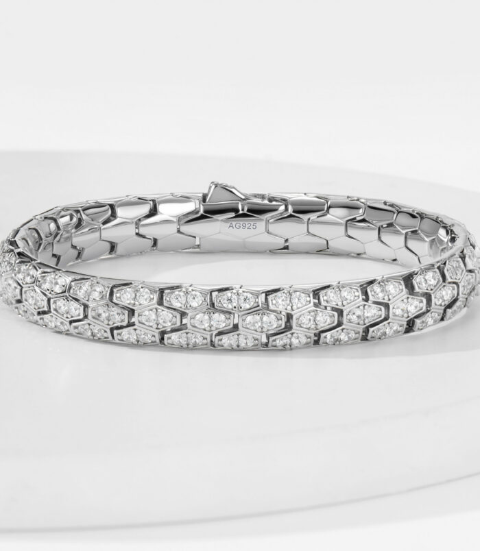 925 Sterling Silver Hexagonal Bracelet with Cubic Zirconia 925 sterling silver bracelet with hexagonal pattern and cubic zirconia stones, polished finish, AG925 stamp visible on inner side.