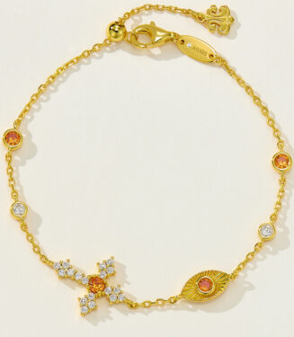 Gold-plated silver bracelet with orange and white cubic zirconia accents, adjustable chain