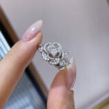 hand held close-up of Romantic Rose Design Sterling Silver Ring