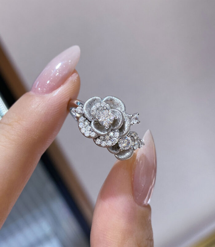 hand held close-up of Romantic Rose Design Sterling Silver Ring