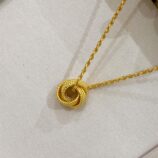 Modern Gold-Plated Sterling Silver Knot Pendant Necklace displayed in jewelry box