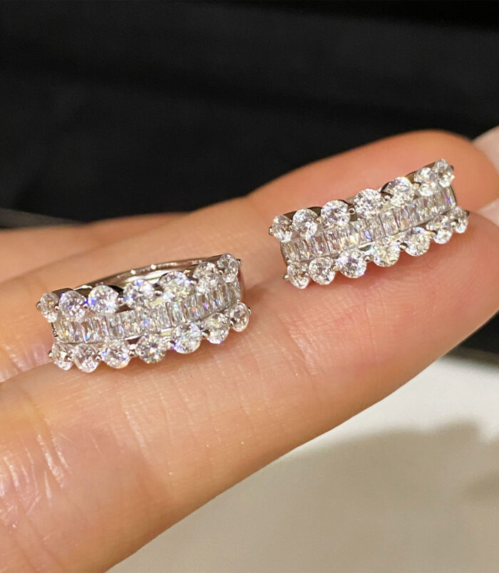 Sterling Silver Cubic Zirconia Huggie Hoop Earrings handheld details hand held close up of Sterling Silver Cubic Zirconia Huggie Hoop Earrings