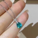 hand held close-up of Rhodium plated Minimalist Sterling Silver Pear-Shaped Paraiba Necklace