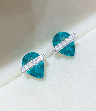 Sterling Silver Paraiba Zirconia Stud Earrings displayed in a jewelry box