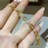 handheld close-up of 925 silver multi-cut diamond bracelet