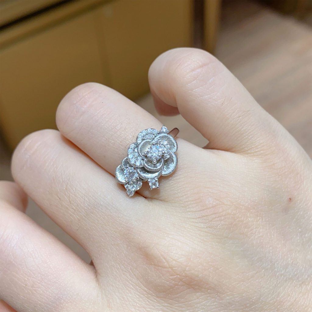 Romantic Rose Design Sterling Silver Ring worn on a model's finger