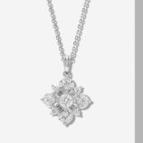Exquisite sterling silver necklace featuring an intricate snowflake-shaped pendant adorned with a mix of round, marquise, and baguette-cut white cubic zirconia stones, creating a dazzling and sophisticated look perfect for adding a touch of winter wonderland charm to any outfit.