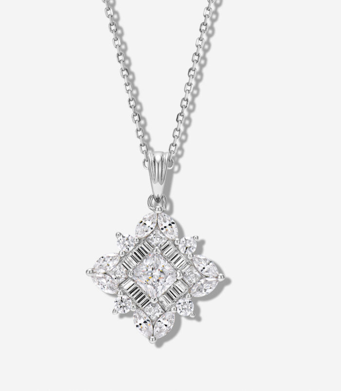 Exquisite sterling silver necklace featuring an intricate snowflake-shaped pendant adorned with a mix of round, marquise, and baguette-cut white cubic zirconia stones, creating a dazzling and sophisticated look perfect for adding a touch of winter wonderland charm to any outfit.