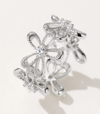 Exquisite sterling silver ring with a delicate floral design, featuring intricate rope-textured petals and sparkling zircon centers, offering a romantic and elegant look.