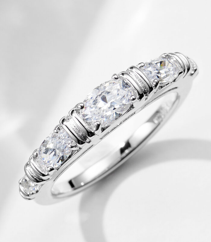 Single 925 sterling silver eternity band from a stackable set, featuring a continuous row of round brilliant-cut cubic zirconia stones set in a polished 925 sterling silver band, creating a sleek and minimalist look perfect for everyday wear or stacking with other rings.
