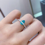 Pear-Shaped Paraiba Sterling Silver Ring worn on a model's finger