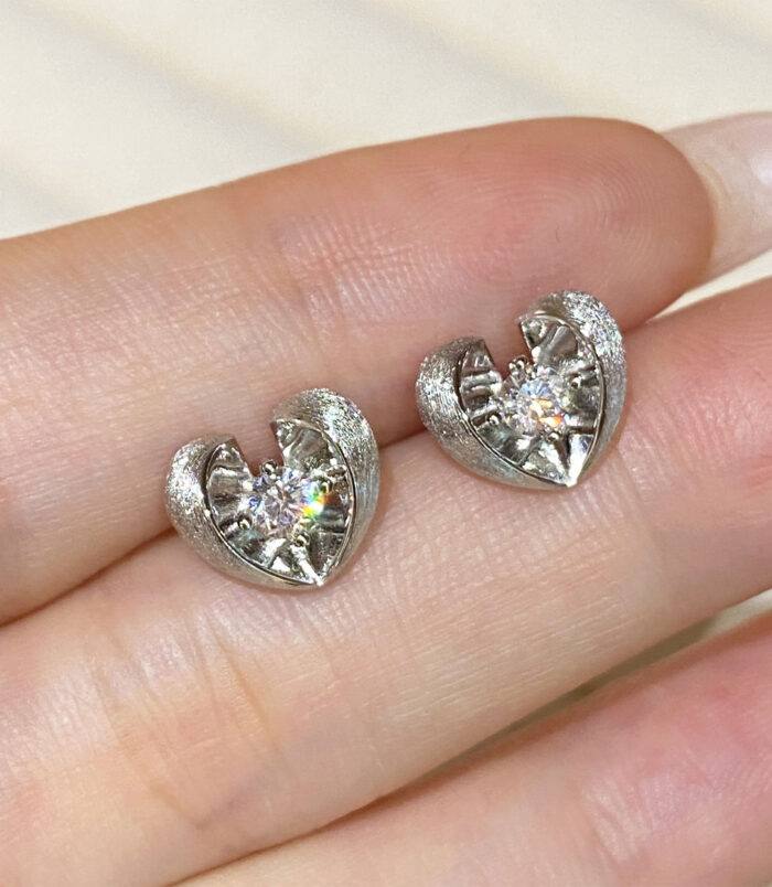 Sterling Silver Brushed Gold-Plated Heart Stud Earrings handheld details hand held close up of Sterling Silver Brushed Gold-Plated Heart Stud Earrings
