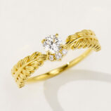side view close-up of tiny Leaf crown zirconia ring