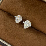 Sterling Silver Pear cut Cubic Zirconia Stud Earrings on a jewelry box