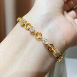 925 silver multi-cut diamond bracelet worn on wrist, featuring alternating round and baguette-cut diamond accent