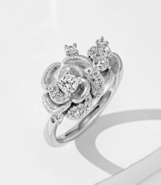 Elegant sterling silver ring with a lifelike rose design, featuring textured petals and sparkling zircon accents, perfect for adding a touch of romance to any outfit.