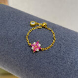 Pink Gemstone Sterling Silver ring with Zircon Accents on a Jewelry display rack