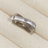 Rhodium plated Sterling Silver Star Engraved Textured Bands on a jewelry box