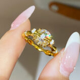 hand held close-up of 18K Gold-Plated Sterling Silver Ring with Round Zircon Stone