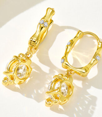 back view close up of Sterling silver with bamboo-shaped zirconia Huggie Hoop Earrings