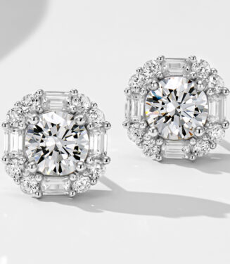 Luxurious sterling silver stud earrings, featuring a large round brilliant-cut white cubic zirconia stone as the centerpiece, surrounded by a halo of alternating baguette-cut and round brilliant-cut white cubic zirconia stones, creating a regal and sophisticated look perfect for adding a touch of glamour to any outfit.