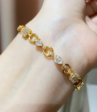 925 silver multi-cut diamond bracelet worn on wrist, featuring alternating round and baguette-cut diamond accent