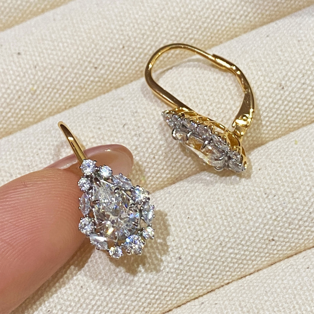 side view close up of Sterling Silver Gold-Plated Pear-Cut Cubic Zirconia Drop Earrings