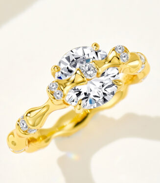 18K gold-plated sterling silver ring with a large round-cut zircon stone and small diamond accents, presenting an elegant and luxurious look.