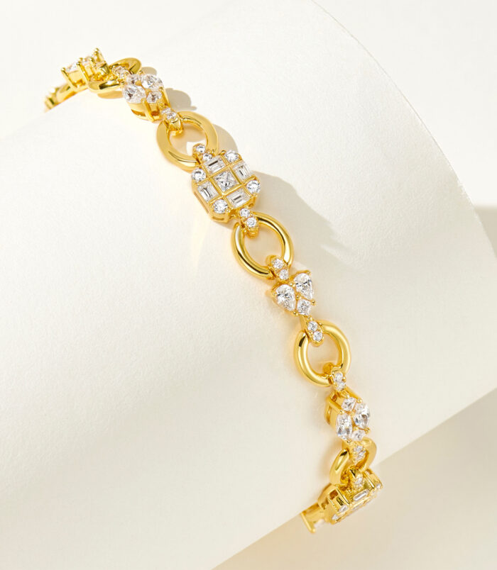 side view of 18k gold plated 925 silver bracelet with multi-cut diamond accent, highlighting its unique design