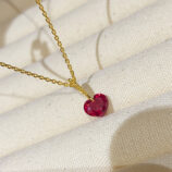Charming Sterling Silver Heart-Shaped Red Zirconia Stone Necklace displayed in jewelry box