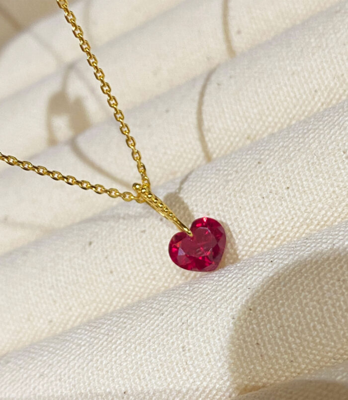 Charming Sterling Silver Heart-Shaped Red Zirconia Stone Necklace in jewelry box Charming Sterling Silver Heart-Shaped Red Zirconia Stone Necklace displayed in jewelry box