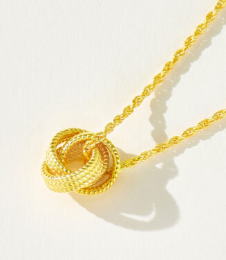 side view close-up of Modern Gold-Plated Sterling Silver Knot Pendant Necklace