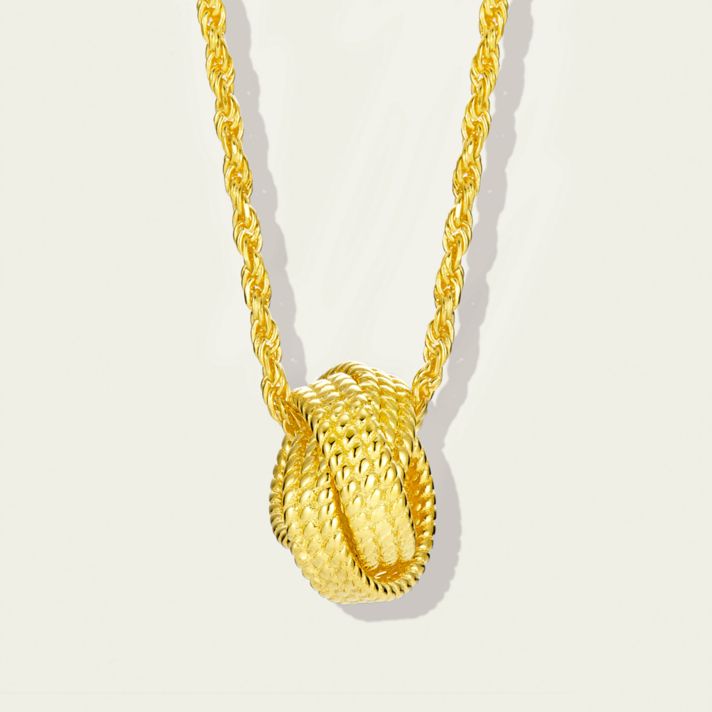 Stylish gold-plated sterling silver necklace featuring a unique knot-shaped pendant with a textured finish, paired with a classic rope chain, creating a modern and sophisticated look perfect for adding a touch of elegance to any outfit.