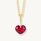 Romantic gold-plated sterling silver necklace featuring a heart-shaped brilliant-cut red cubic zirconia stone, suspended from a uniquely designed gold-plated sterling silver bail with a textured pattern, creating a charming and eye-catching look perfect for expressing love and adding a touch of elegance to any outfit.
